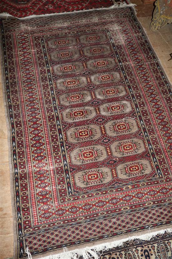 Red patterned Bokhara rug(-)